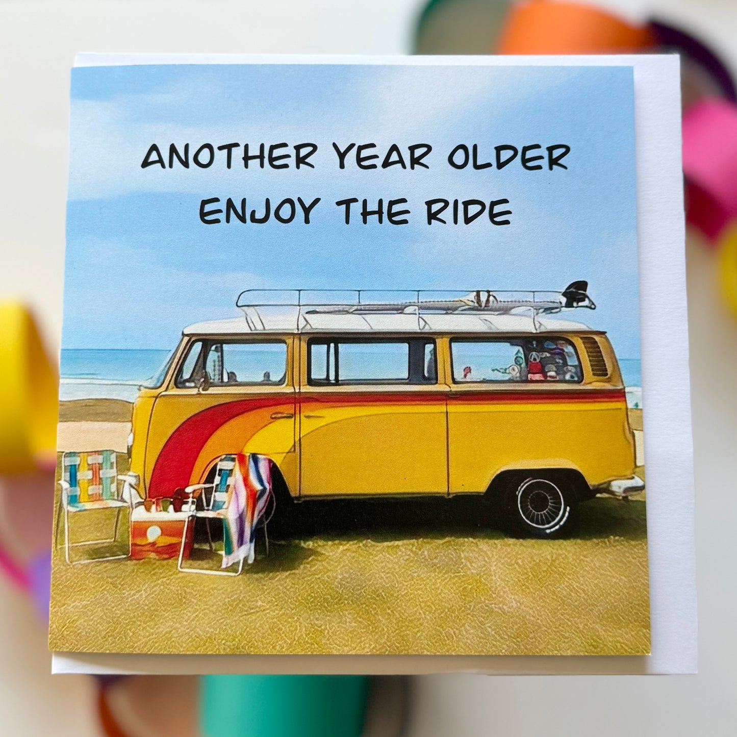 Kombi 70s vw bus parked at the beach with vintage chairs and esky birthday card with envelope