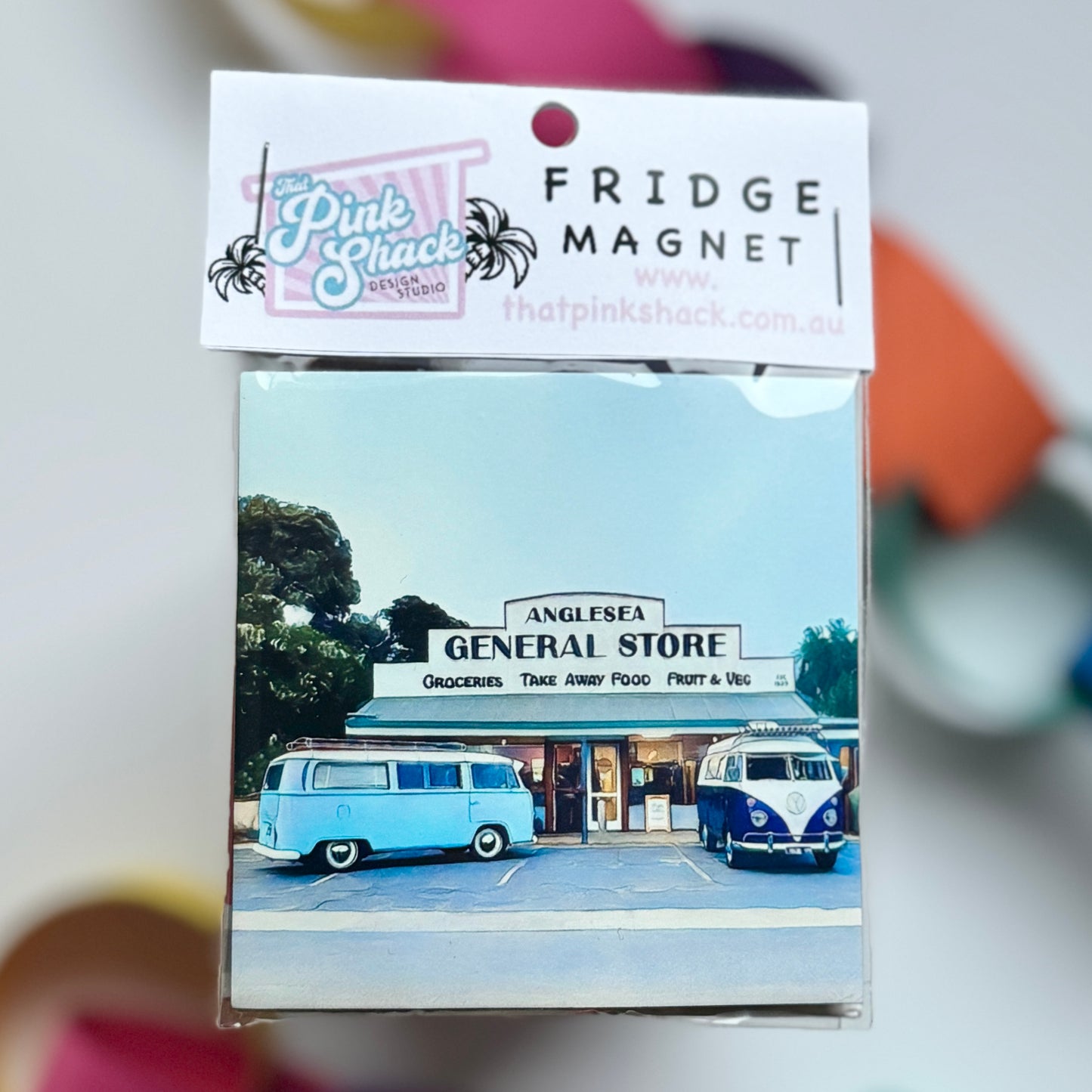 Two classic Vw Kombis parked outside the iconic Anglesea General Store, Surf Coast, Victoria Fridge magnet in packaging
