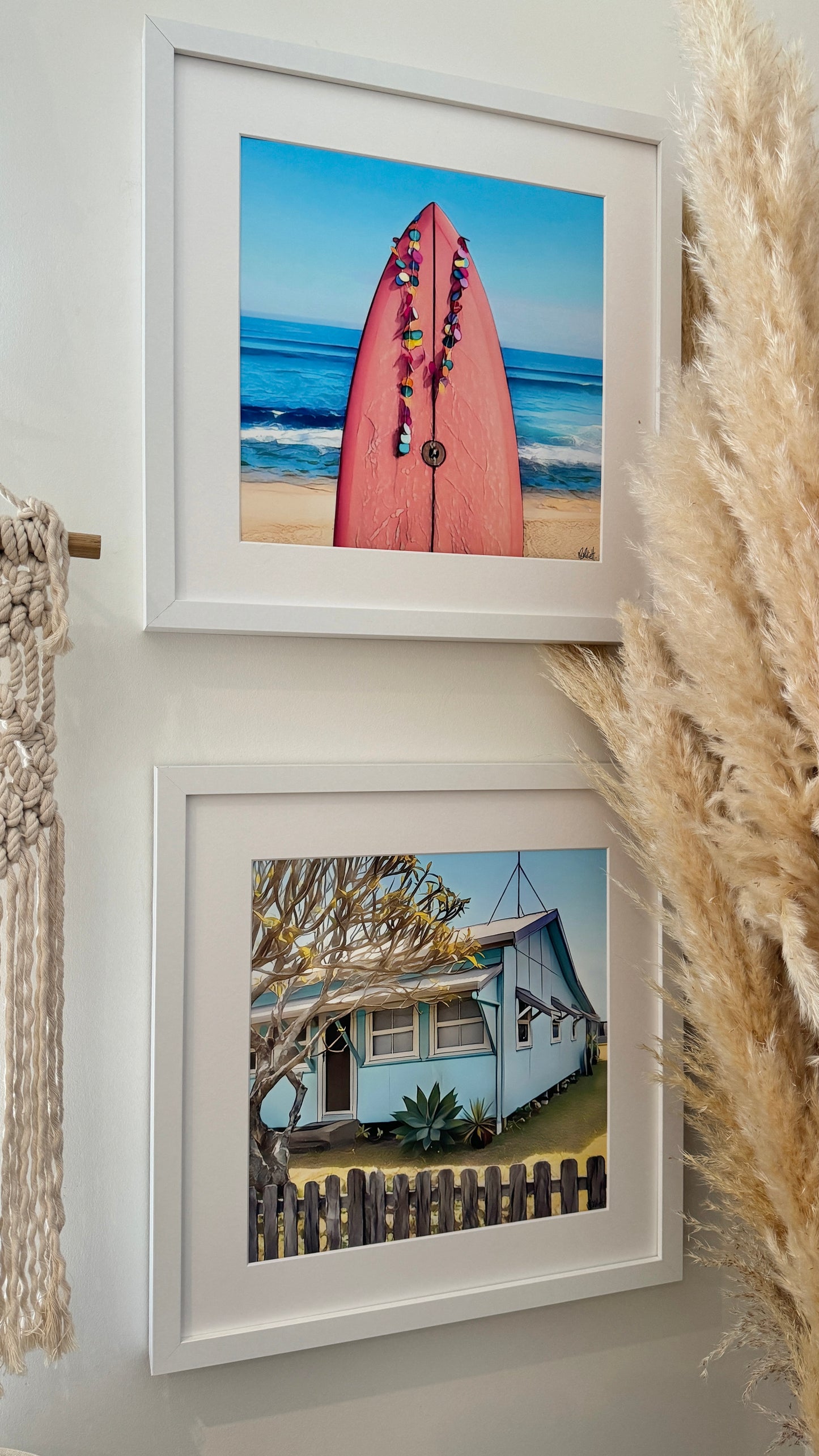 A print wth mat framed of a cool beach surf shack in Lennox head And a pink surfboard overlooking the beach