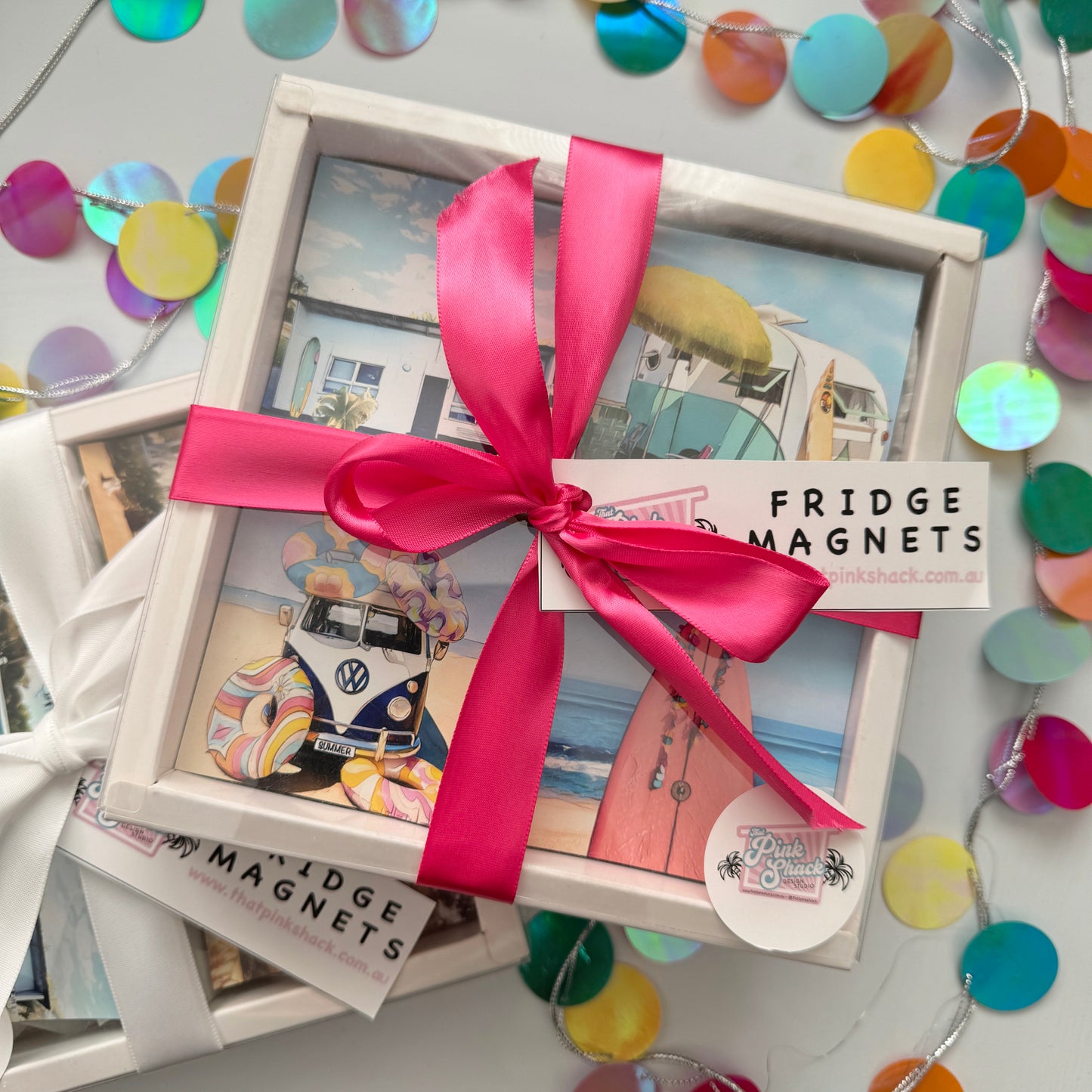 Set of four fridge magnets in a gift box with a ribbon surfer girl fun colourful magnet set.
Surf Shack, Vintage caravan, Kombi on the beach, Pink surfboard