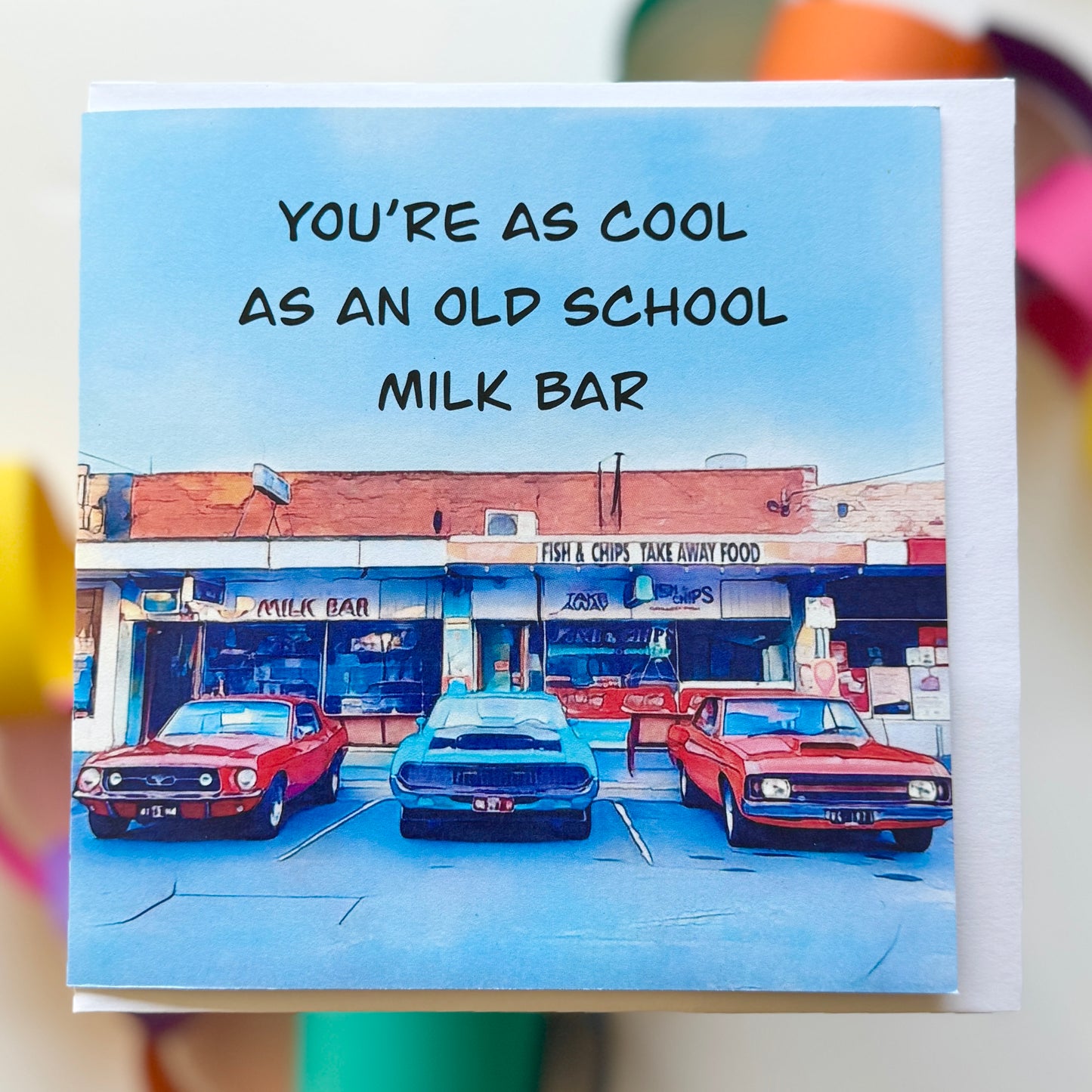 Classic cars parked outside a milk bar and fish and chip shop greeting card with envelope