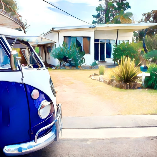 purple and white vintage van parked in front of a modern house with greenery.