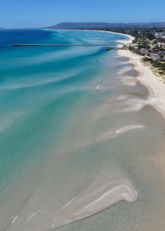 Aerial view of Rye Pier and sandy shoreline on the Mornington Peninsula.