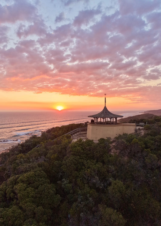 Sunset over the ocean with Coppins lookout in the foreground overlooking Sorrento beach at Sunset 