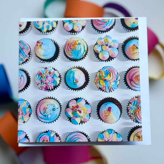 A colourful set of fun cupcakes with coloured piping on a greeting card