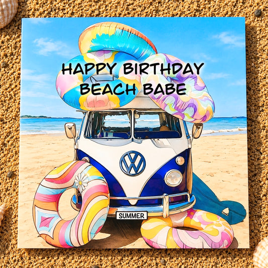 A square greeting card featuring a retro VW bus on a sandy beach with colourful inflatable rings , with the text 'HAPPY BIRTHDAY BEACH BABE' overlaid, displayed on a sandy surface.
