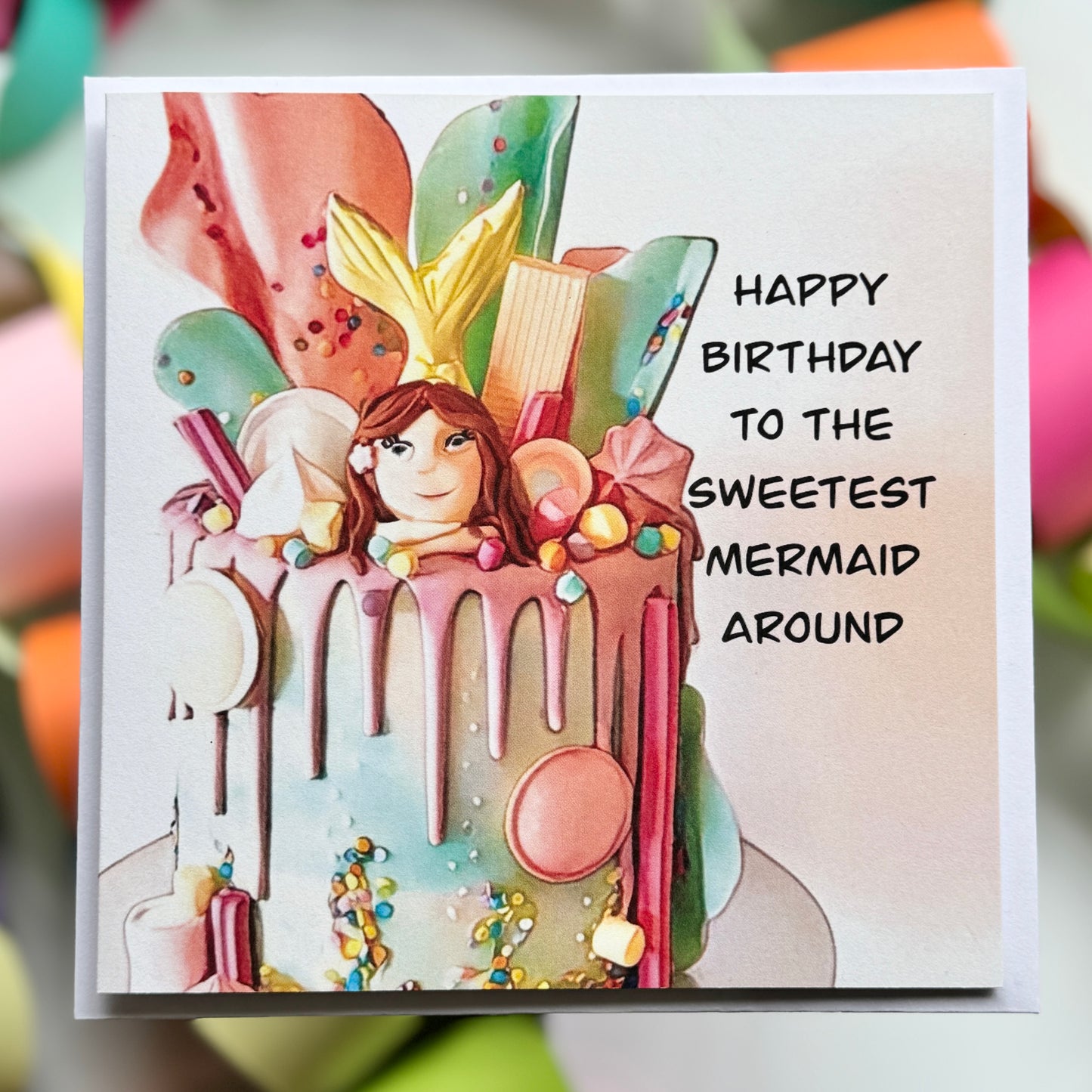 Birthday cake with a mermaid on top of it saying Happy Birthday to the sweetest mermaid around Greeting Card with envelope
