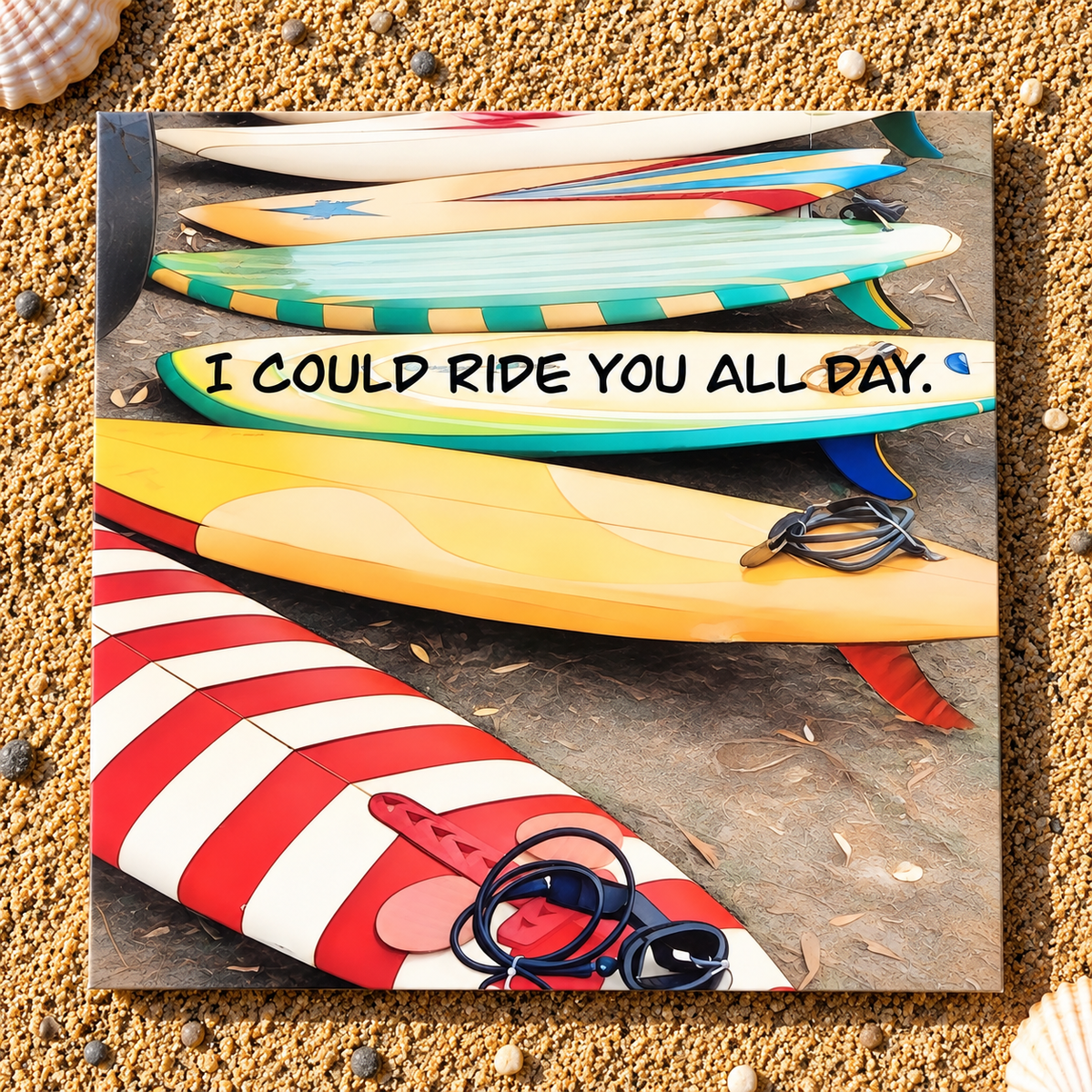 A square printed greeting card featuring a colorful graphic of stacked surfboards with the text 'I COULD RIDE YOU ALL DAY.' in black handwritten font.