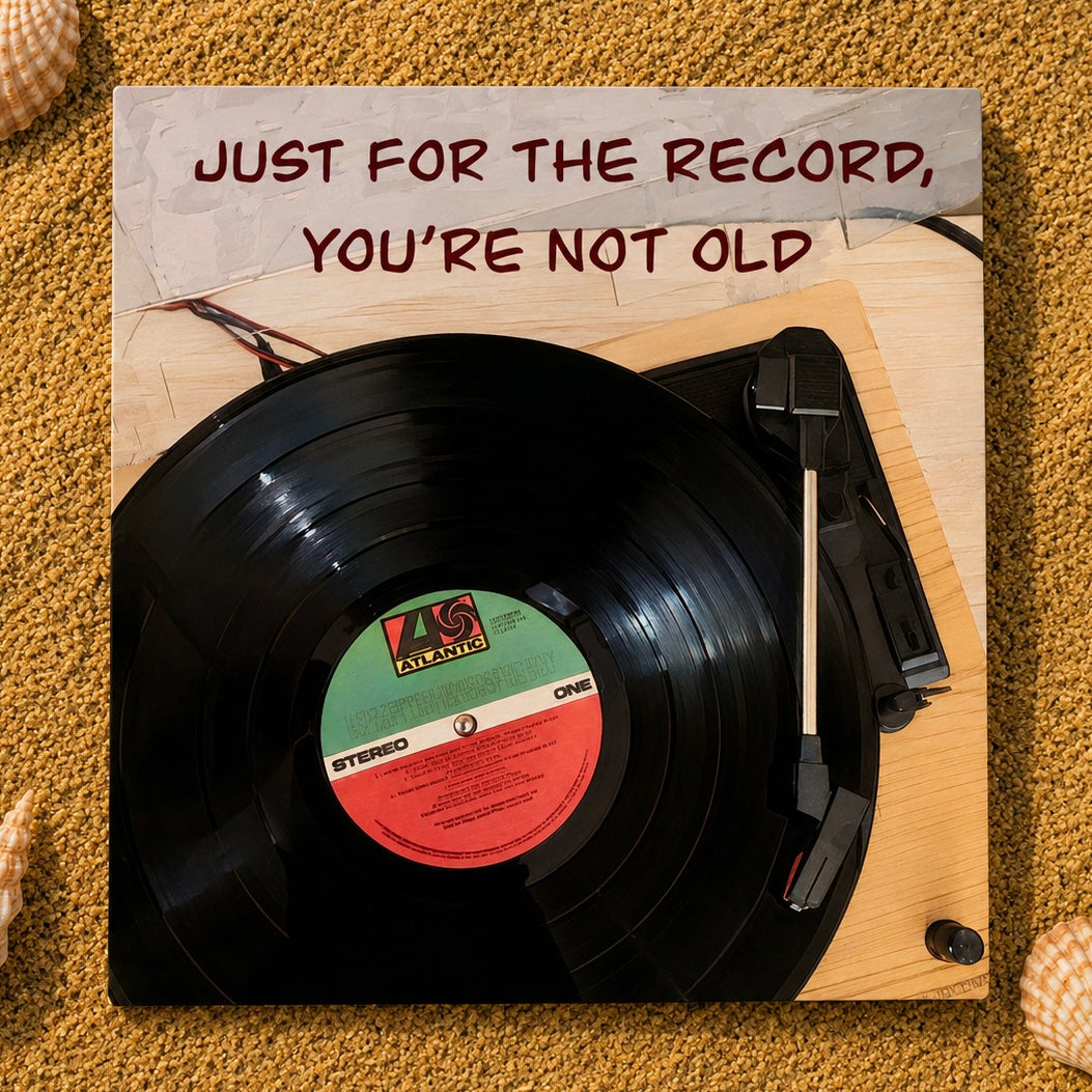 A square greeting card featuring a black record on a turntable, with the text 'JUST FOR THE RECORD, YOU'RE NOT OLD' at the top. The record label shows 'KS Exports' and 'STEREO ONE'.