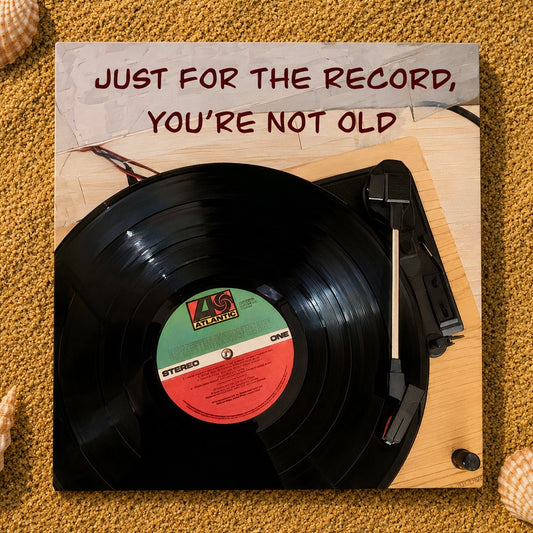 A square greeting card featuring a black record on a turntable, with the text 'JUST FOR THE RECORD, YOU'RE NOT OLD' at the top. The record label shows 'KS Exports' and 'STEREO ONE'.