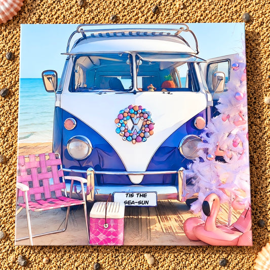 A square greeting Christmas card featuring a Kombi vw bus on the beach with pink Christmas tree, vintage esky and retro camp chair 