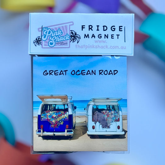 Two kombis vw bus  parked overlooking the ocean beach fridge magnet
