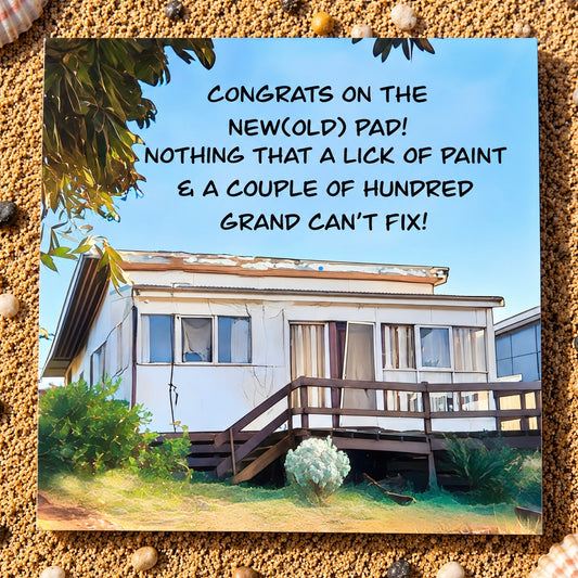 Square greeting Card with an old house illustration with the house falling down and the  text congrats_on_the_new_old_pad._Nothing_that_a_lick_of_paint_and_a_couple_of_hundred_grand_can_t_fix