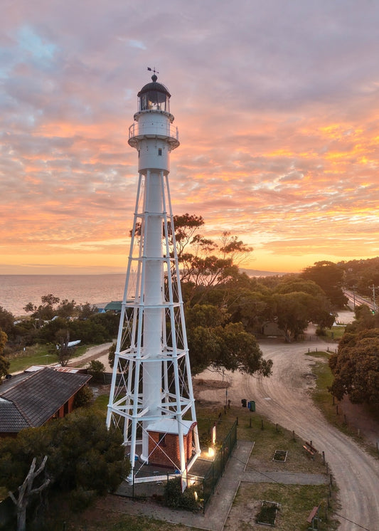 Print of Mccrae Lighthouse at sunrise with a colourful sky and Port Phillip bay in the background 