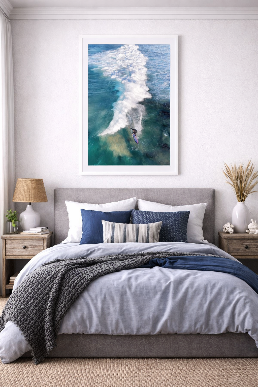 Bedroom with a bed, nightstands, and a large framed picture of a surfer on a wave.