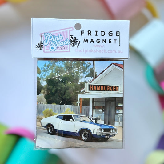 A fridge magnet wth an xa ford coupe parked outside the hamburger in rosebud morinngton peninsula in packaging